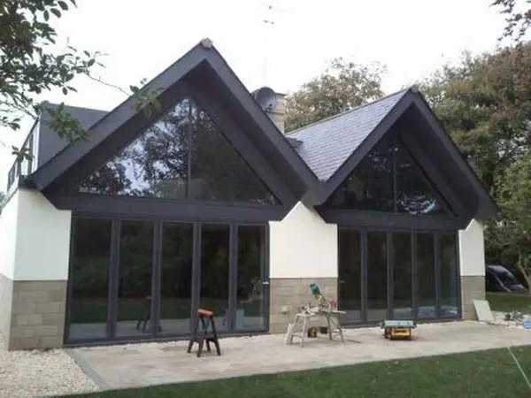 HANDFORD , CHESHIRE : New Build project to install Allstyle Alumnium Curtan Walling , Triple glazed with 36mm units. Timber Front Door by Kleober Funky Door